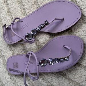 Purple thong-style sandals with decorative beads